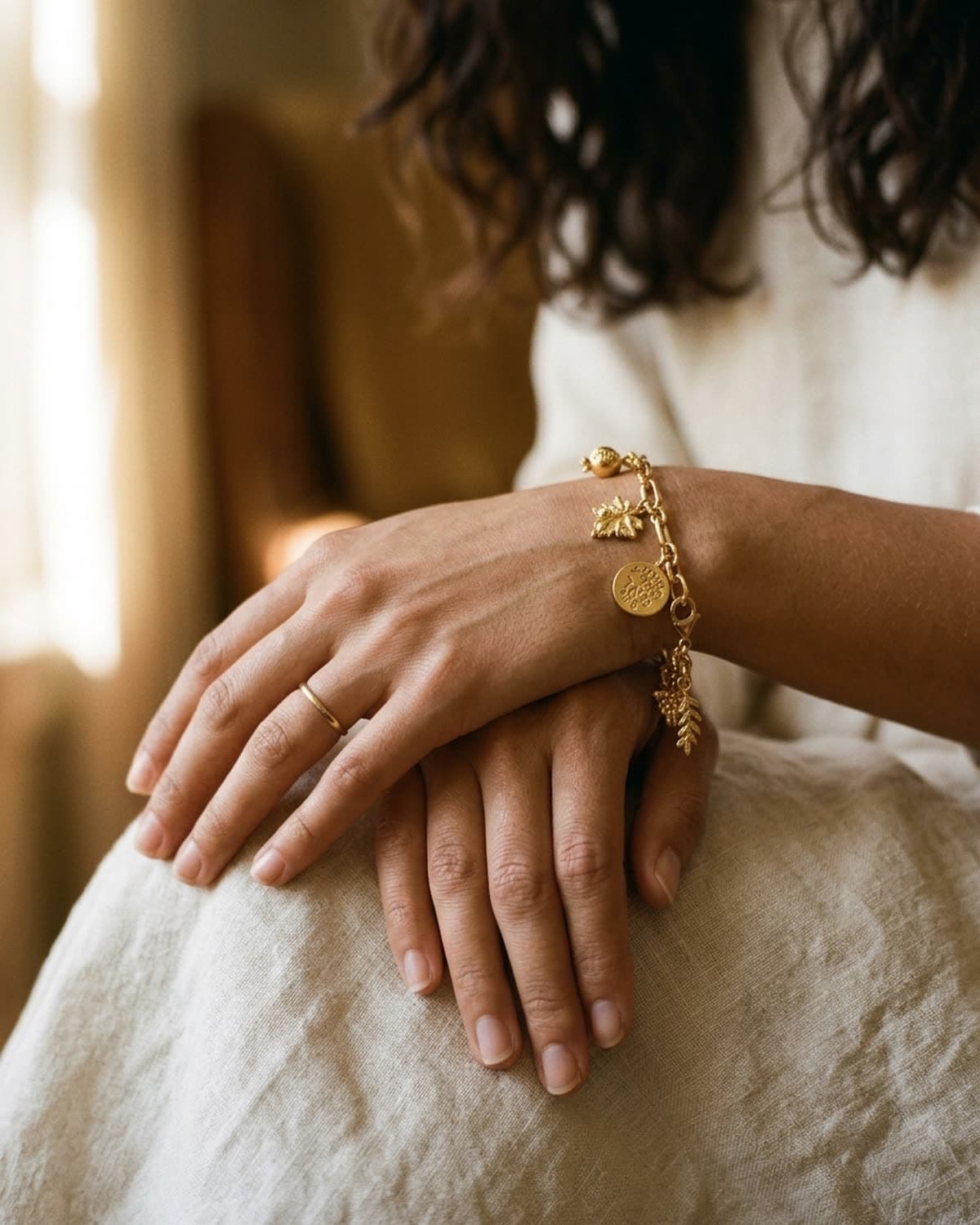 bracelet photographed with bling ai — hands resting, soft window