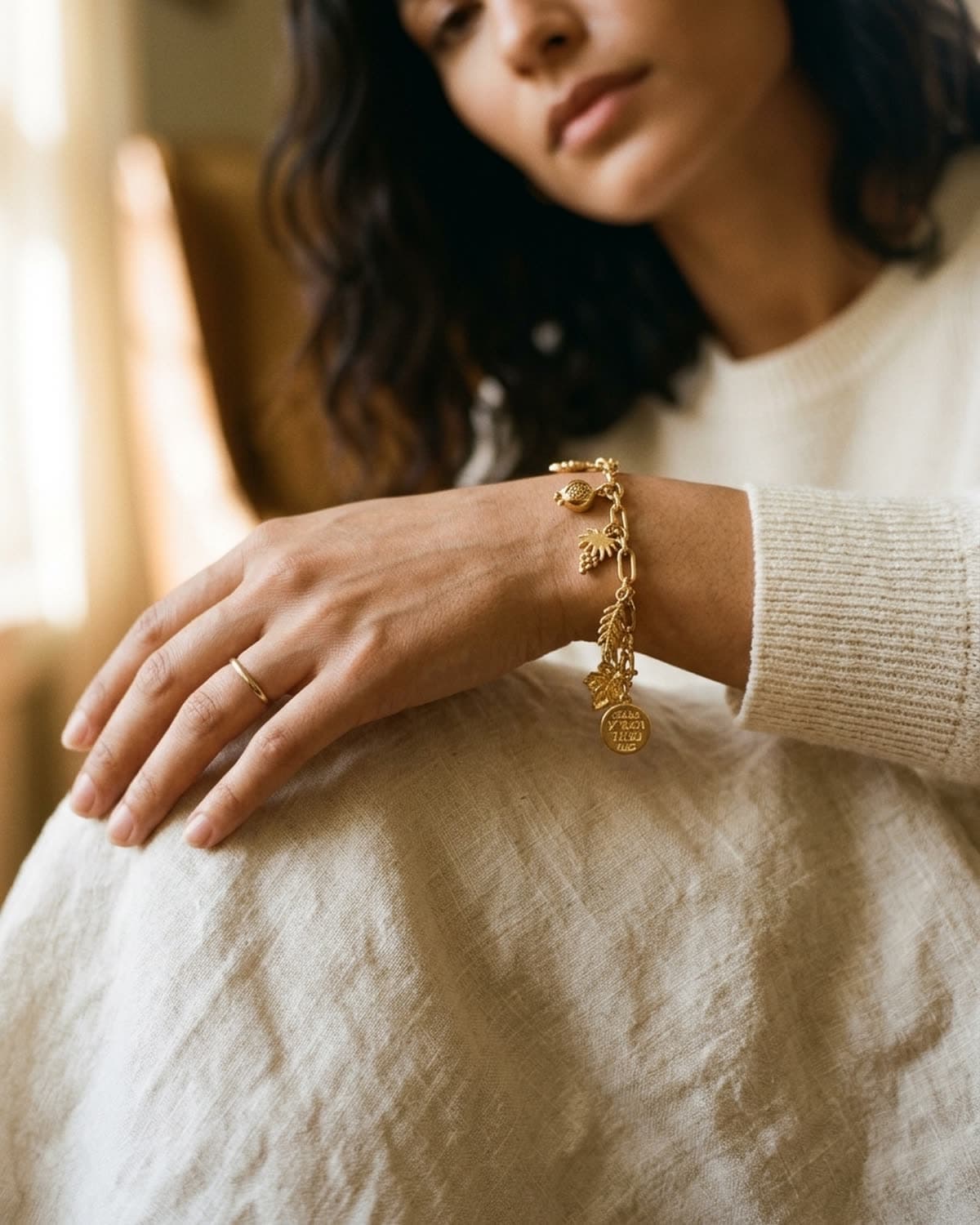 bracelet photographed with bling ai — wrist, cream linen